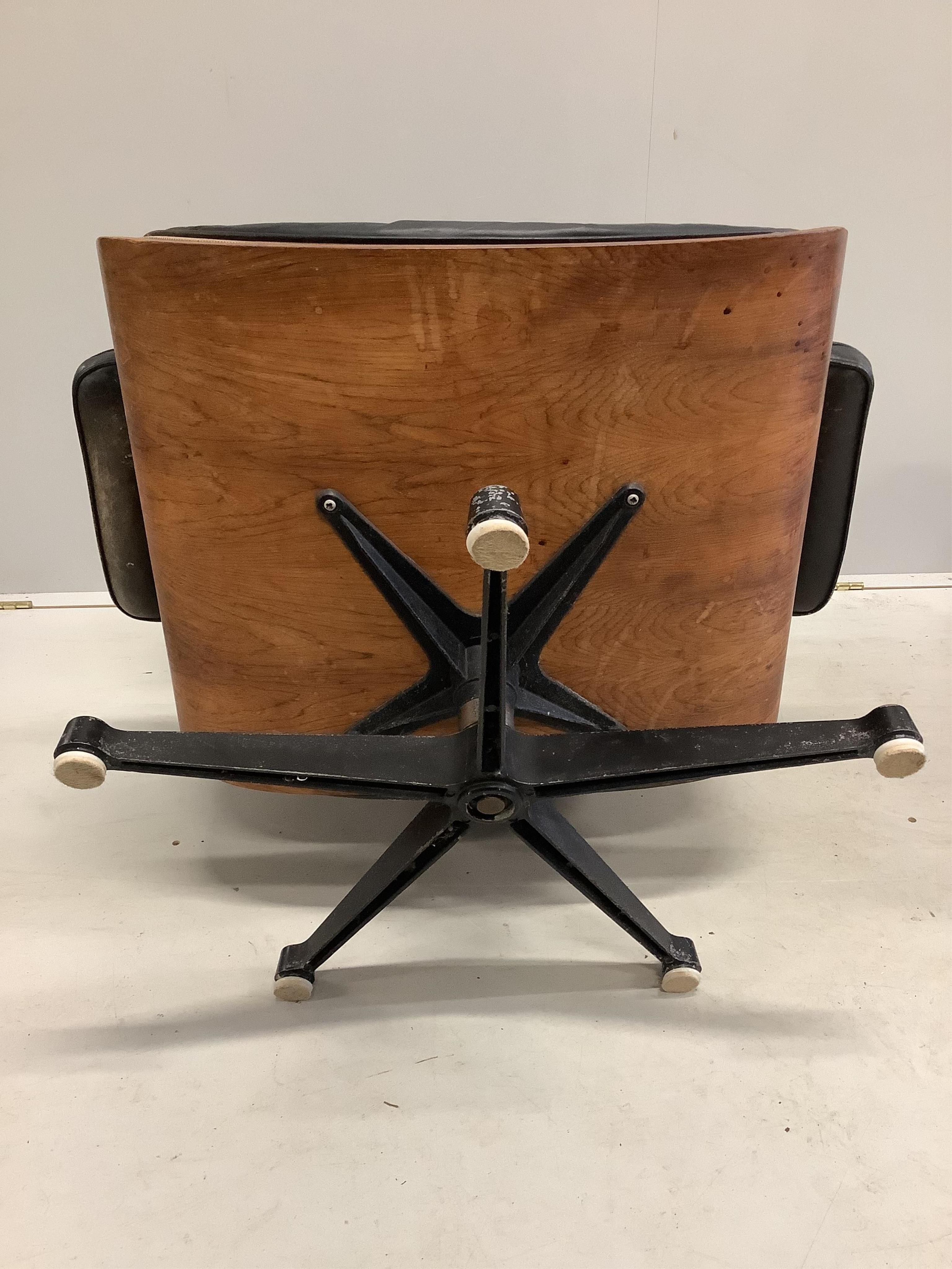 Charles and Ray Eames for Herman Miller Interform, an Indian rosewood and black leather lounge chair and ottoman, circa 1960, chair width 85cm, depth 68cm, height 81cm. Condition - poor to fair